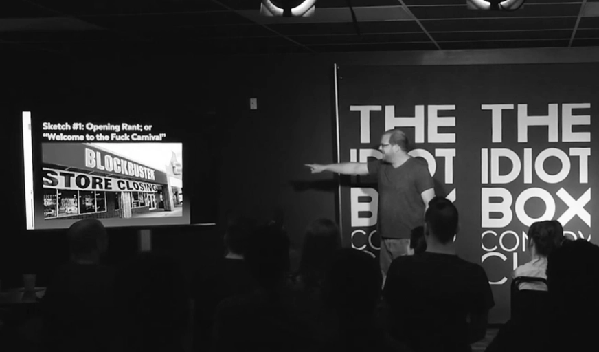 Bob on stage at The Idiot Box performing sketch comedy.